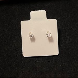See Photos. Sterling Silver earrings with Cubic Zircon. They are white.